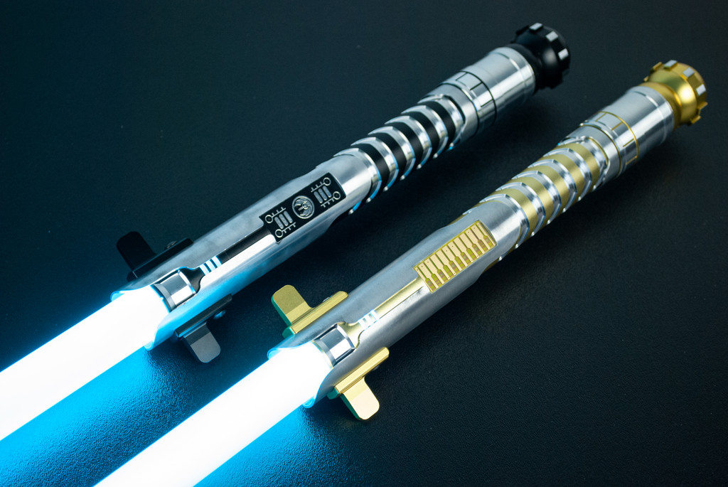 Top: Blackout Allegiant Smart Saber® with a black Order of Light switch. Bottom: Gold Allegiant Smart Saber® with a gold standard switch.