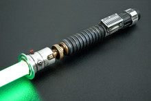 Lightly weathered Aurora Smart Saber® with red greeblie, silver control box and black standard switch.