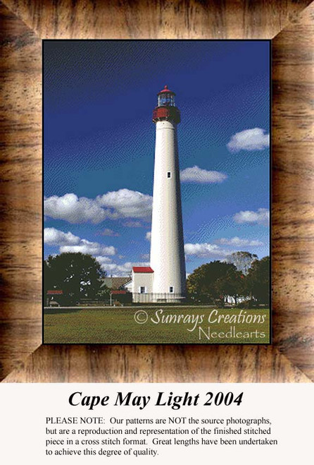 A lighthouse stands tall against a clear blue sky, framed by clouds and greenery, presented as an xstitch chart titled Cape May Light 2004.