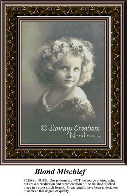 A little girl with curly, blond hair and a playful expression is shown, waiting as your next cross stitch project.