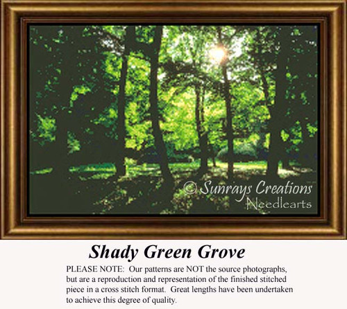 Bright green trees stand in a dense forest with sunlight beaming down, framed as a counted cross stitch chart.
