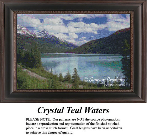 A serene waterscape of teal blue water framed by towering trees and mountains, designed as a cross stitch pattern for stitchers.