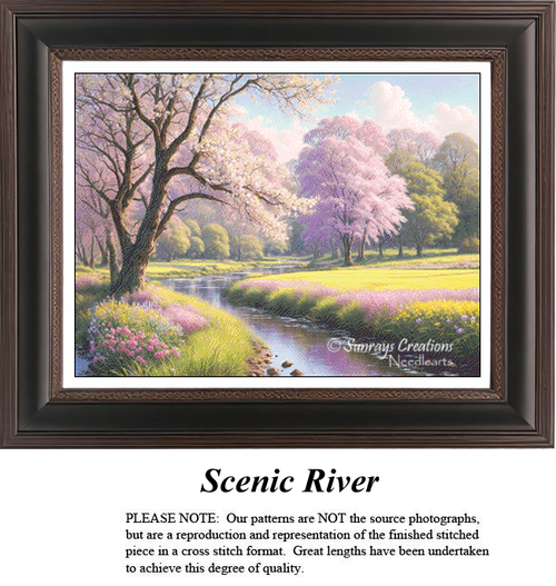 A peaceful country stream winds through a lush meadow vibrant with blooming pink cherry blossom trees and colorful wildflowers under a bright spring sky in a serene landscape cross-stitch pattern.