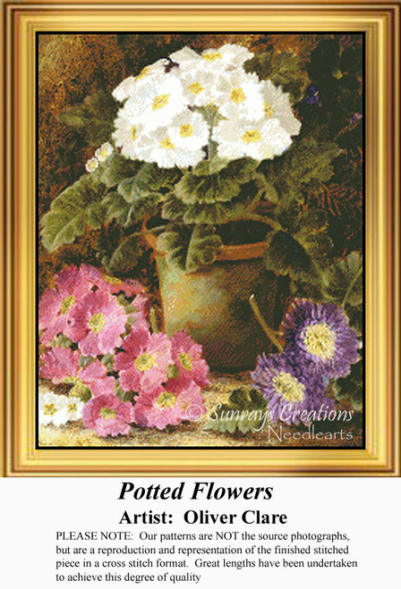 A cross stitch chart of potted primroses in pink, violet, and white, designed by Oliver Clare, with lush green leaves surrounding the flowers.