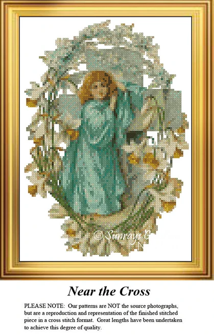 An angel stands beside a cross, surrounded by flowers, designed for you as a counted cross stitch kit.