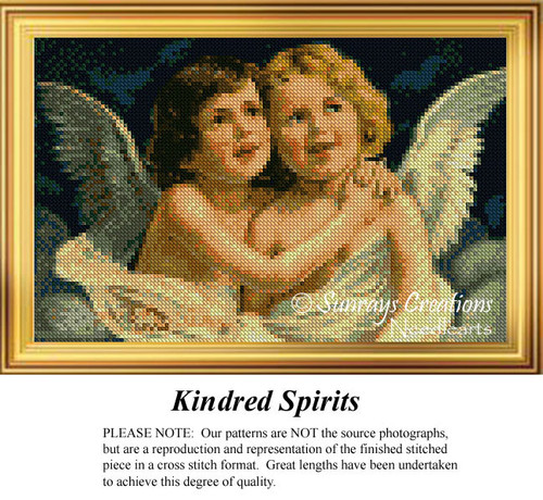 Two cherubic angels embrace each other, surrounded by deep blue, in this large cross stitch pattern, ready for stitching with DMC floss on aida cloth.