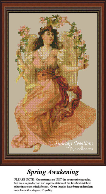 A serene angel in a peach gown and sash sits among flowers, designed as a large counted cross stitch pattern by Sunrays Creations.