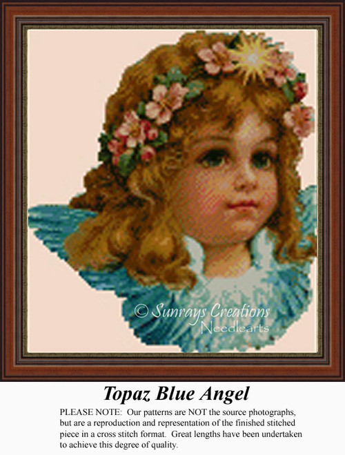 A young angel with flowing brown hair, wearing a floral crown, appears in shades of blue for this counted cross stitch kit.