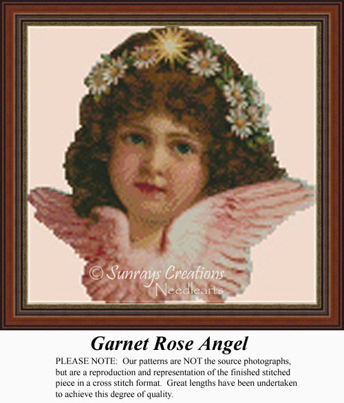An angel with curly hair and rosy attire wears a crown of daisies, frozen in time as a counted cross stitch pattern.