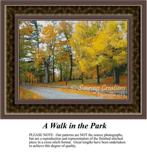 A serene path lined with golden autumn trees creates a tranquil scene, captured as a counted cross stitch pattern.