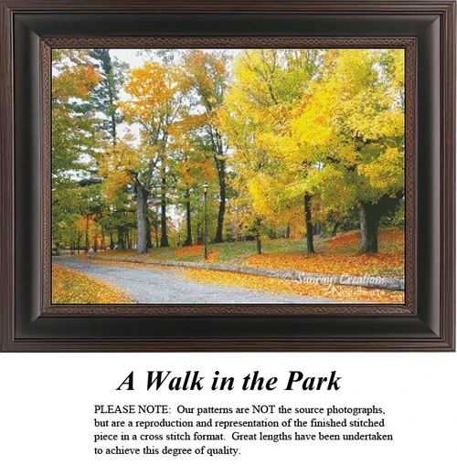 A serene path lined with golden autumn trees creates a tranquil scene, captured as a counted cross stitch pattern.