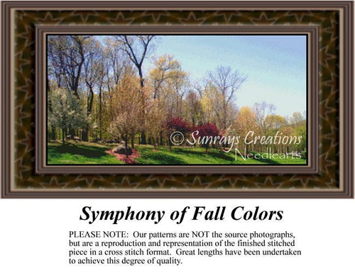 A serene hillside scene with vibrant autumn trees in various colors, perfect for this cross stitch design, framed by green grass and a bright sky.