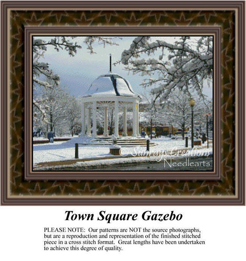 A snow-covered gazebo stands in a park, surrounded by bare branches, depicted in this cross stitch chart, perfect for winter stitching projects.