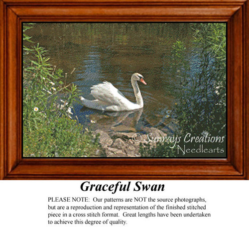 A lone swan glides gracefully across a sunny pond, surrounded by lush greenery, brought to life as a counted cross stitch pattern.