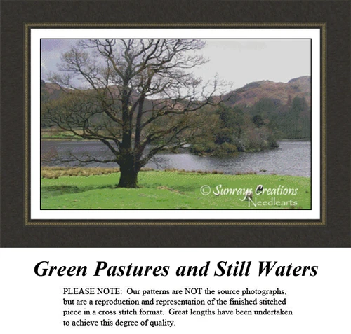 A tree stands by a calm river, with sheep grazing nearby and lush greenery in the background, ideal for a cross stitch project.