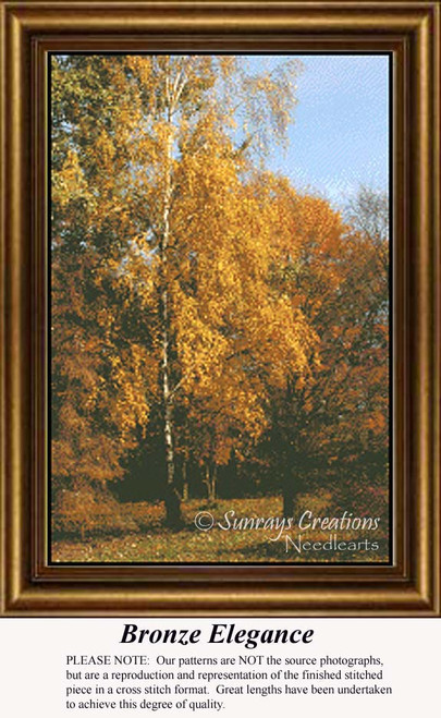 A tall tree with branches adorned in bronze leaves stands against a soft blue sky, depicted in the digital pattern titled Bronze Elegance.