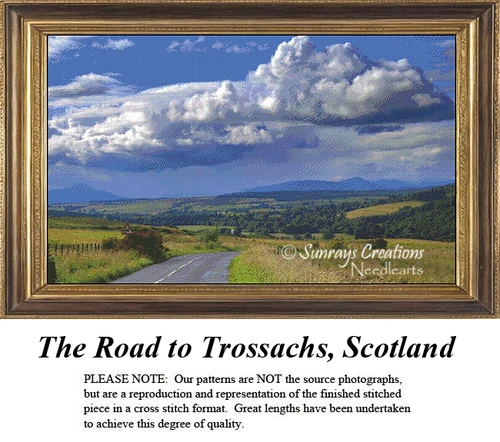 A detailed counted cross-stitch pattern preview of the Scottish landscape artwork, "The Road to Trossachs, Scotland." The dramatic design features a paved country road winding through golden fields and rolling green hills under a towering, billowing white storm cloud across a deep blue sky.
