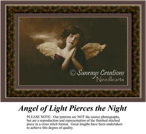 An angel poses with hands clasped in prayer, her wings illuminating the scene, available as a counted cross stitch pattern.