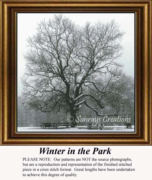 A large, leafless tree stands in a snowy park, composed as a counted cross stitch pattern that emphasizes solid colors.