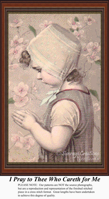A little girl in vintage clothing bows her head in prayer, brought to life as a counted cross stitch pattern.