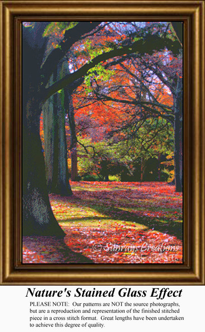 A forest path lined with trees in autumn, showcasing red, gold, and violet leaves against dark branches, available as a digital file for cross stitch.