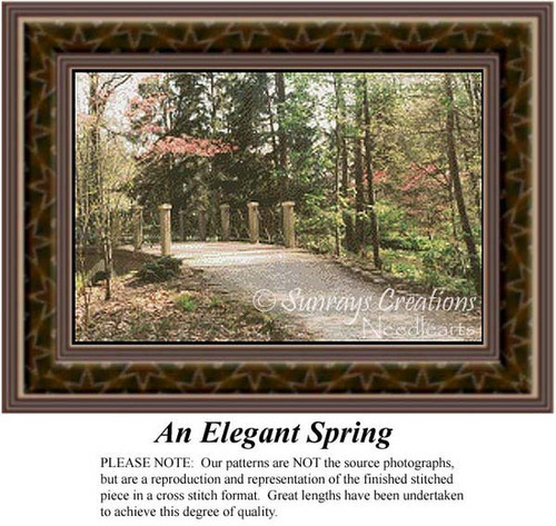 A serene park scene with tall pines and vibrant trees, including a Camelot bridge, perfect for your next cross stitch project.
