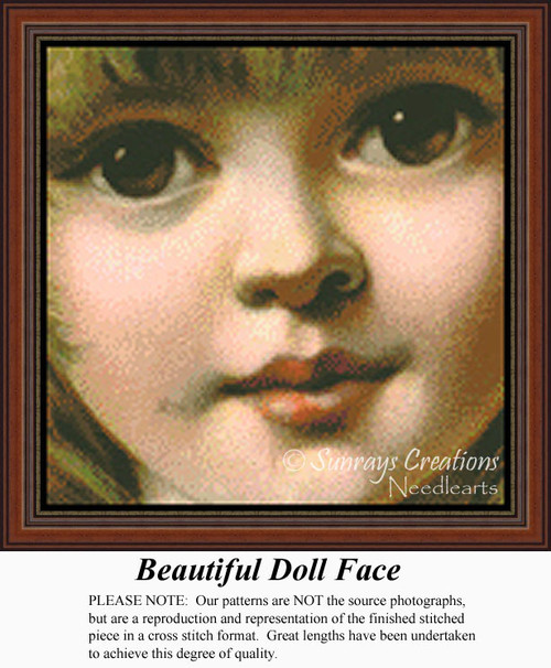 A closeup of a doll's face with large eyes and soft features, reimagined as a counted cross stitch pattern.