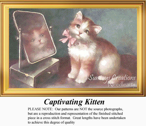 A reddish-tan kitten with white fur and a pink ribbon gazes at its reflection in a mirror, available as a PDF chart for cross stitch.