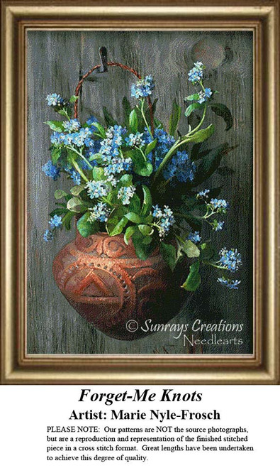 A vase filled with blue forget-me-not flowers rests against a weathered wooden door, designed by Marie Nyle-Frosch as a PDF pattern for cross stitch.