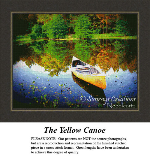 A yellow canoe rests at the edge of a serene lake surrounded by trees, rendered in colorful stitches in this xstitch kit.