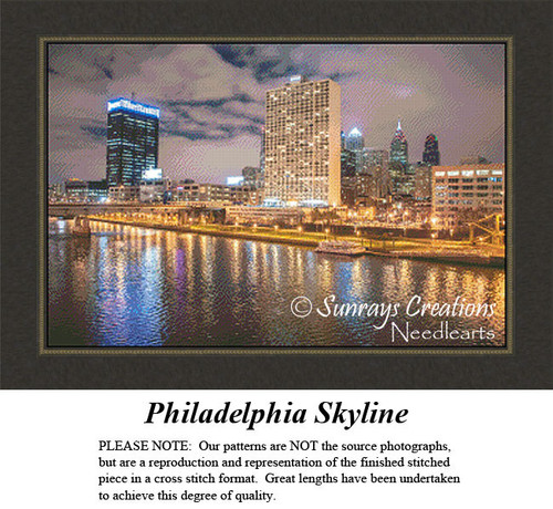 A view of the Philadelphia skyline at dusk, illuminated against the cloudy sky, reflecting in the water; available as a downloadable pattern.