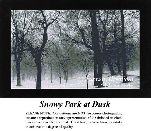 A winter landscape with barren trees and a gray sky, shown as a large counted cross stitch, evoking the stillness of a snowy park at dusk.