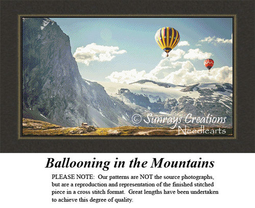Two hot air balloons float over a vast mountain ridge, translated into a counted cross stitch design for nature lovers!