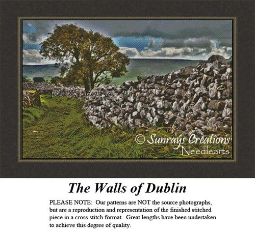A rocky stone wall lines the green countryside of Dublin, accompanied by a solitary tree, presented as a cross stitch kit for your stitching pleasure.