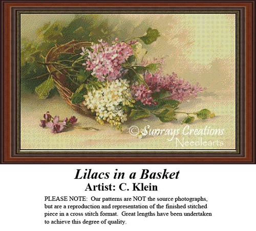 A basket overflows with pink, violet, and white lilacs, designed as a counted cross stitch pattern, waiting as your next cross stitch project.
