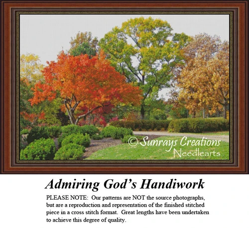 Vibrant fall trees in orange, chartreuse, and bronze set a serene scene, waiting as your next cross stitch project.