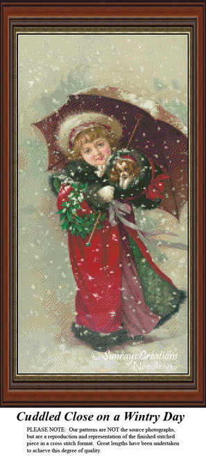 A young girl in a red coat holds an umbrella while cuddling her small dog, accompanied by a Christmas wreath, in this PDF pattern.