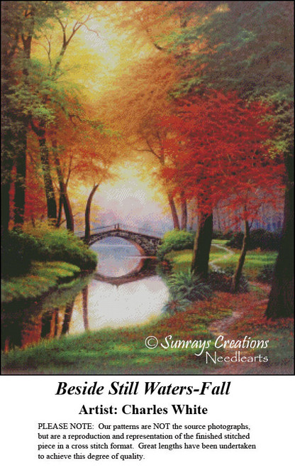 A serene woodland scene with vibrant fall foliage and a bridge over a brook, brought to life as a counted cross stitch pattern.