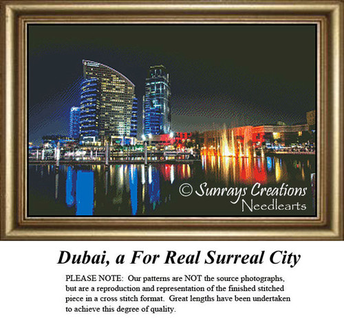 A vibrant night scene of Dubai city lights, reflecting on the water, designed as a BAP cross stitch by Sunrays Creations.