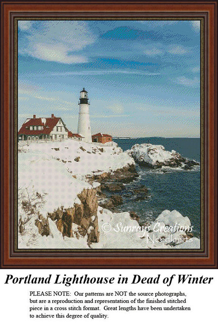 A snowy Portland Head Lighthouse stands against a bright sky, with rocky shores and coastline visible in this xstitch chart design.