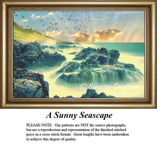A sunlit seascape with rocky shores and birds flying above, yours to stitch as a counted cross stitch chart.