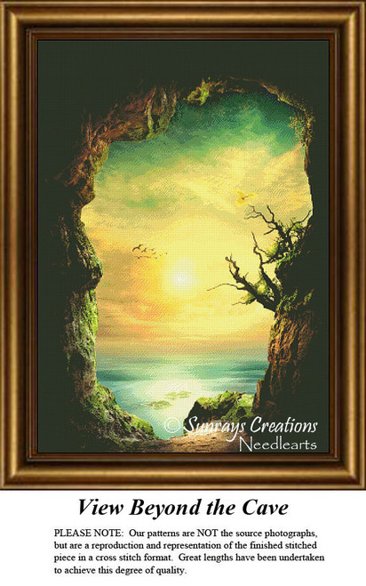 A large counted cross stitch design reveals a view from within a cave opening, showcasing a golden sky above a calm sea and rocky shores.