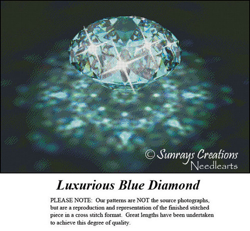 A sparkling blue diamond rests in the center, surrounded by shimmering hints of aqua, teal, and white in this xstitch pattern design.
