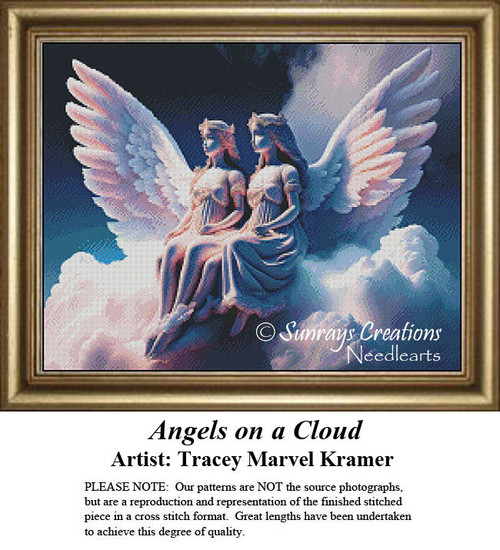 Two angels with large wings sit on a fluffy cloud, gazing down from the heavens in this cross stitch project, designed by Tracey Marvel Kramer.