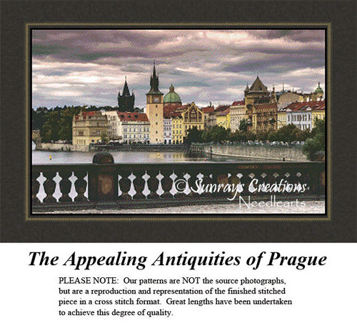 The skyline of Prague reflects on the water's surface, frozen in time as a counted cross stitch pattern.