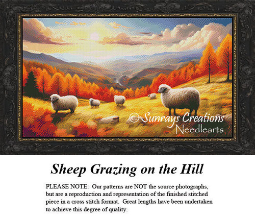 A flock of sheep grazes on a hillside with vibrant trees and mountains in the background, featured in a counted cross stitch kit.