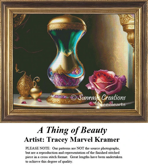 A vibrant urn with emerald and turquoise hues, accented by gold, sits beside a soft mauve rose, offered as a counted cross stitch design.
