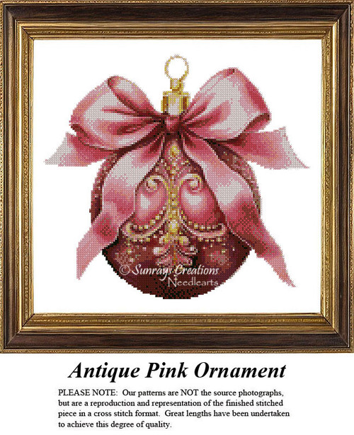 A pink ornament with a large satin bow and golden details is captured as a counted cross stitch pattern.