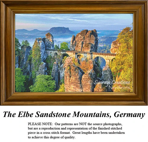 A scenic view of the Elbe Sandstone Mountains above a bridge, designed as a printable pattern for cross stitch using DMC floss on aida cloth.