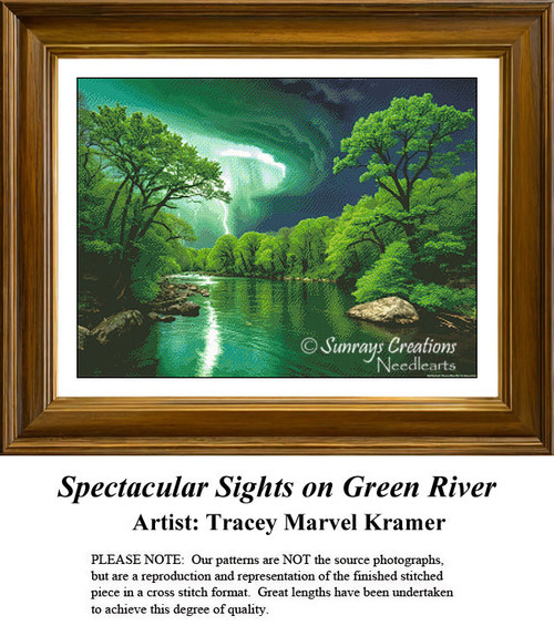 A vibrant waterscape with glowing green trees beside a reflective river under a dramatic sky, offered as a counted cross stitch kit.